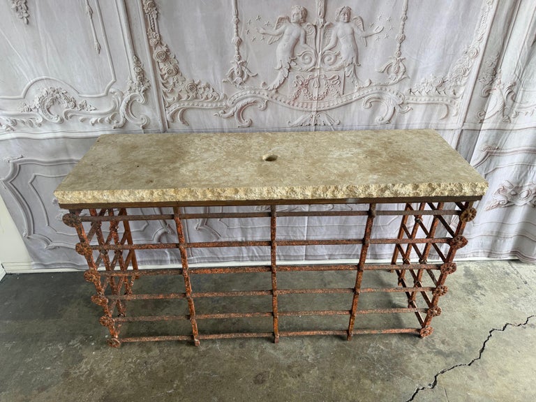 Rustic Console Table with Textured Stone Top and Hand-Forged Iron Base