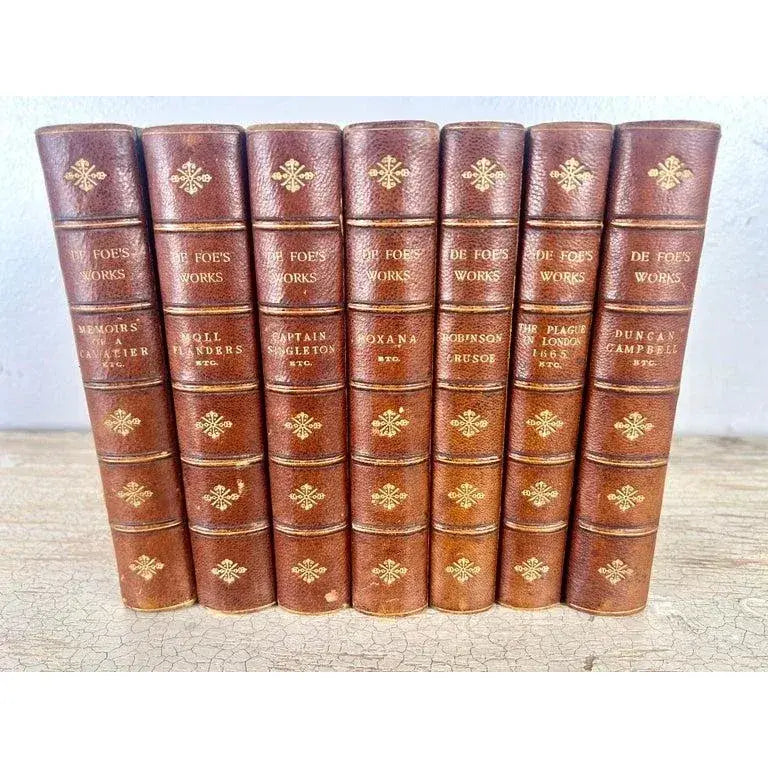 Set of Seven Leather Volumes of Daniel De Foe's Works