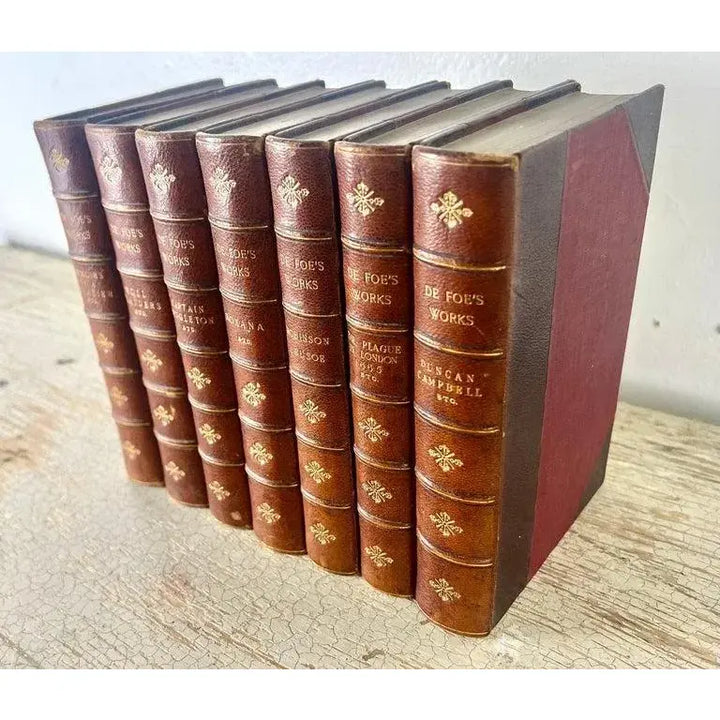 Set of Seven Leather Volumes of Daniel De Foe's Works