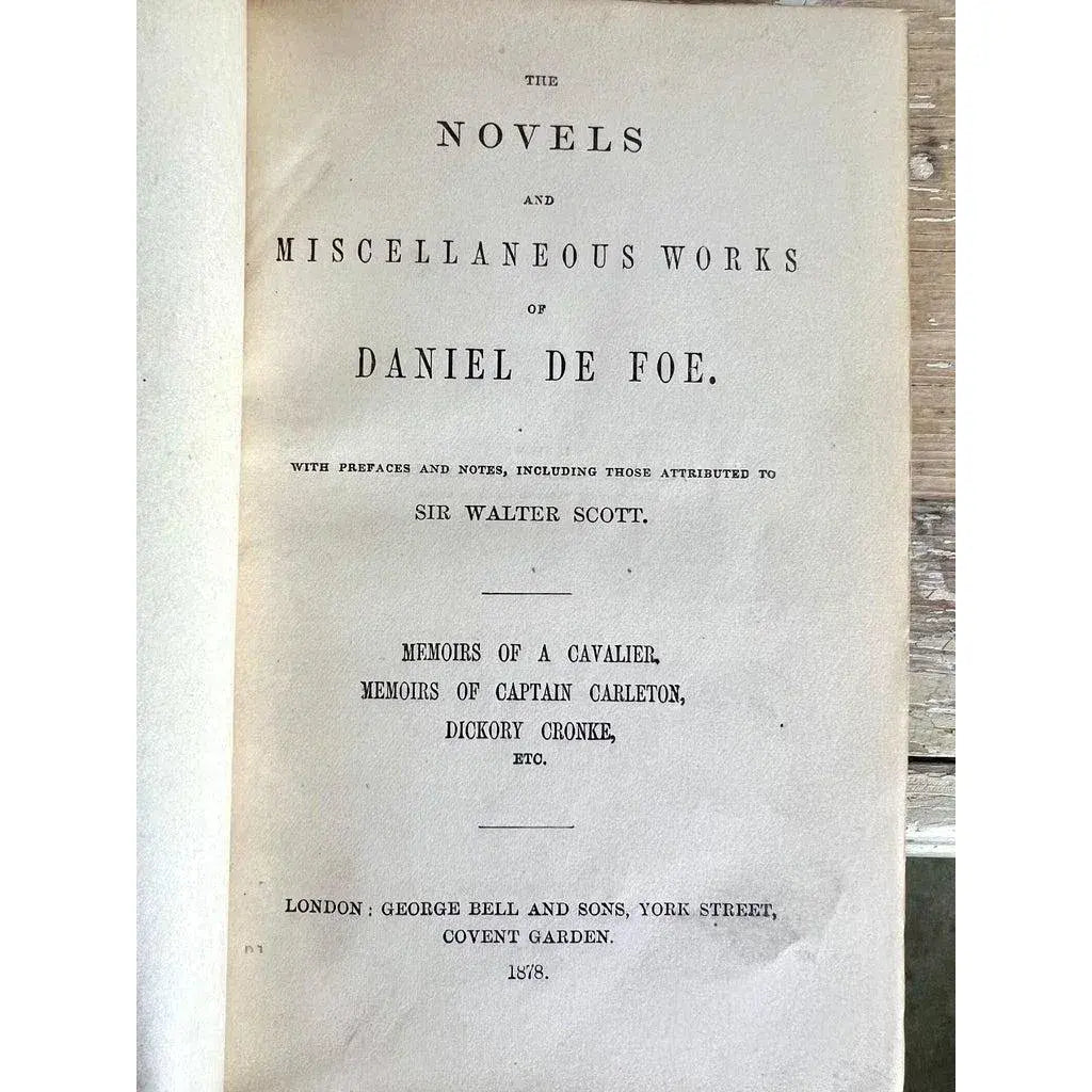 Set of Seven Leather Volumes of Daniel De Foe's Works